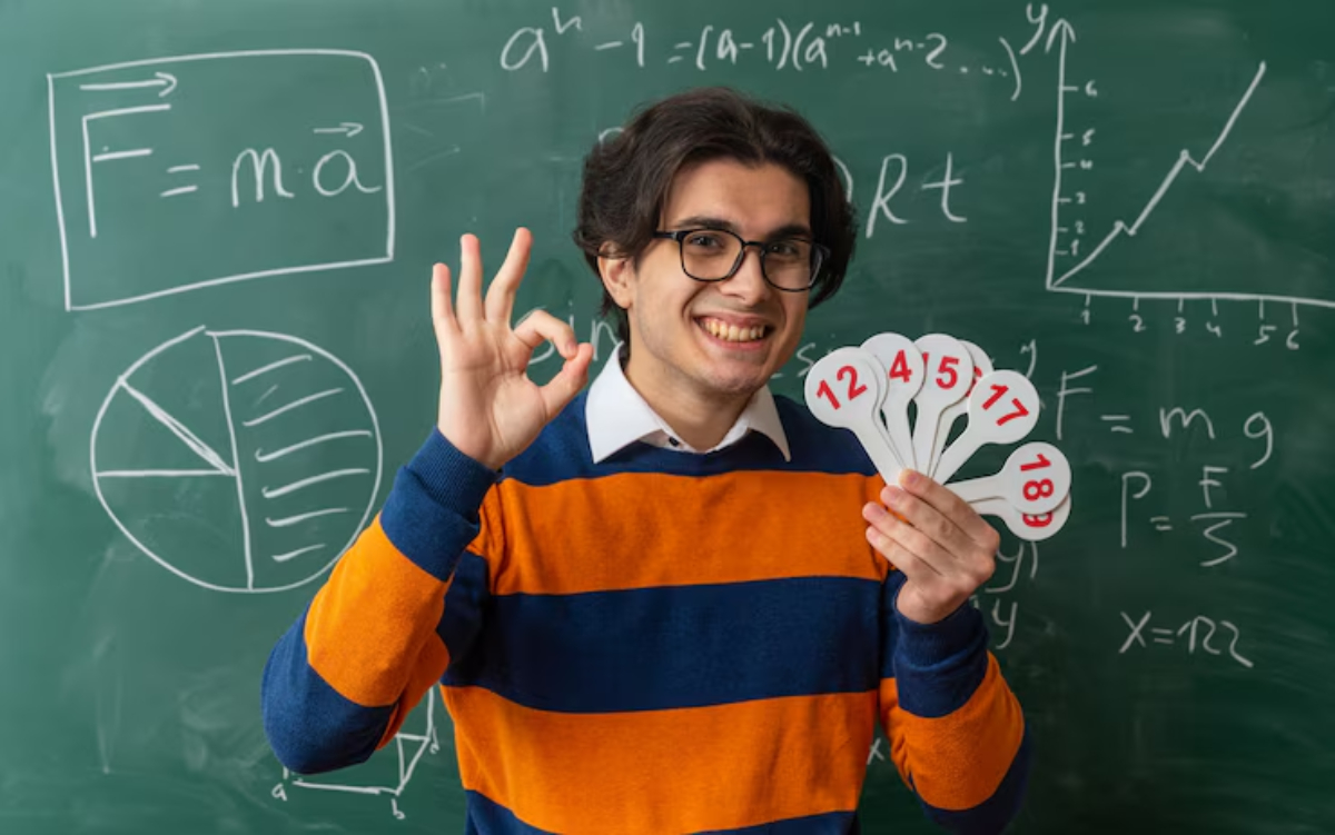 A person in a striped sweater shows numbered cards in front of a chalkboard filled with scientific equations and graphs.
